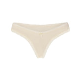 LIGHTWEIGHT COTTON LACE THONG | BUTTER TONAL FLAT ON A WHITE BACKGROUND @ | FLT