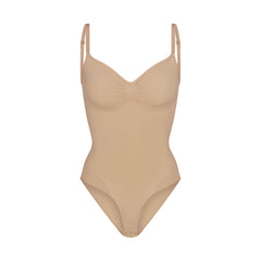 SEAMLESS SCULPT BRIEF BODYSUIT | CLAY (SHAPEWEAR BODYSUITS) LAYS FLAT ON A WHITE BACKGROUND | FLT
