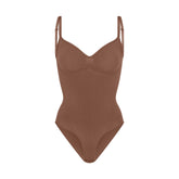 SEAMLESS SCULPT BRIEF BODYSUIT | JASPER (SHAPEWEAR BODYSUITS) LAYS FLAT ON A WHITE BACKGROUND | FLT