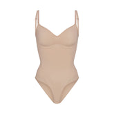 SEAMLESS SCULPT BRIEF BODYSUIT | MICA (SHAPEWEAR BODYSUITS) LAYS FLAT ON A WHITE BACKGROUND | FLT