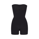 SEAMLESS SCULPT STRAPLESS SHORTIE BODYSUIT | ONYX (ONESIES, BODYSUITS) LAYS FLAT ON A WHITE BACKGROUND | FLT