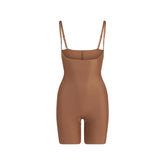 SKIMS BODY CORE SCULPT OPEN BUST MID THIGH BODYSUIT | JASPER FLAT ON A WHITE BACKGROUND | FLT