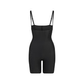 SKIMS BODY CORE SCULPT OPEN BUST MID THIGH BODYSUIT | ONYX FLAT ON A WHITE BACKGROUND | FLT