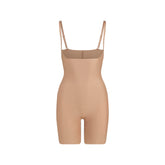 SKIMS BODY CORE SCULPT OPEN BUST MID THIGH BODYSUIT | SIENNA FLAT ON A WHITE BACKGROUND | FLT