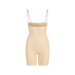 SKIMS BODY CORE SCULPT OPEN BUST MID THIGH BODYSUIT | SAND FLAT ON A WHITE BACKGROUND | FLT
