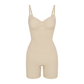 SEAMLESS SCULPT MID THIGH BODYSUIT | SAND (ONESIES, BODYSUITS) LAYS FLAT ON A WHITE BACKGROUND | FLT