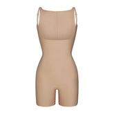 SKIMS BODY CORE SCULPT BACK SMOOTHING OPEN BUST MID THIGH BODYSUIT | CLAY FLAT ON A WHITE BACKGROUND | FLT