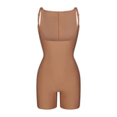 SKIMS BODY CORE SCULPT BACK SMOOTHING OPEN BUST MID THIGH BODYSUIT | SIENNA FLAT ON A WHITE BACKGROUND | FLT