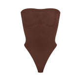 SEAMLESS SCULPT STRAPLESS THONG BODYSUIT | COCOA (SHAPEWEAR BODYSUITS) LAYS FLAT ON A WHITE BACKGROUND | FLT