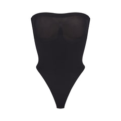 SEAMLESS SCULPT STRAPLESS THONG BODYSUIT | ONYX (SHAPEWEAR BODYSUITS) LAYS FLAT ON A WHITE BACKGROUND | FLT