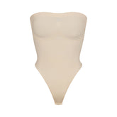 SEAMLESS SCULPT STRAPLESS THONG BODYSUIT | SAND (SHAPEWEAR BODYSUITS) LAYS FLAT ON A WHITE BACKGROUND | FLT