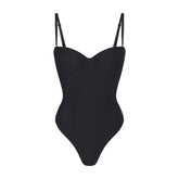 SKIMS BODY UNDERWIRE THONG BODYSUIT | ONYX (SHAPEWEAR BODYSUITS, SHAPEWEAR) LAYS FLAT ON A WHITE BACKGROUND | FLT