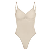 SEAMLESS SCULPT LOW BACK THONG BODYSUIT | SAND (LOW BACK SHAPEWEAR, BODYSUITS) LAYS FLAT ON A WHITE BACKGROUND | FLT
