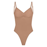 SEAMLESS SCULPT LOW BACK THONG BODYSUIT | SIENNA (LOW BACK SHAPEWEAR, BODYSUITS) LAYS FLAT ON A WHITE BACKGROUND | FLT