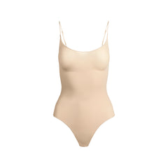 SHEER SEAMLESS THONG BODYSUIT | SAND FLAT ON A WHITE BACKGROUND | FLT