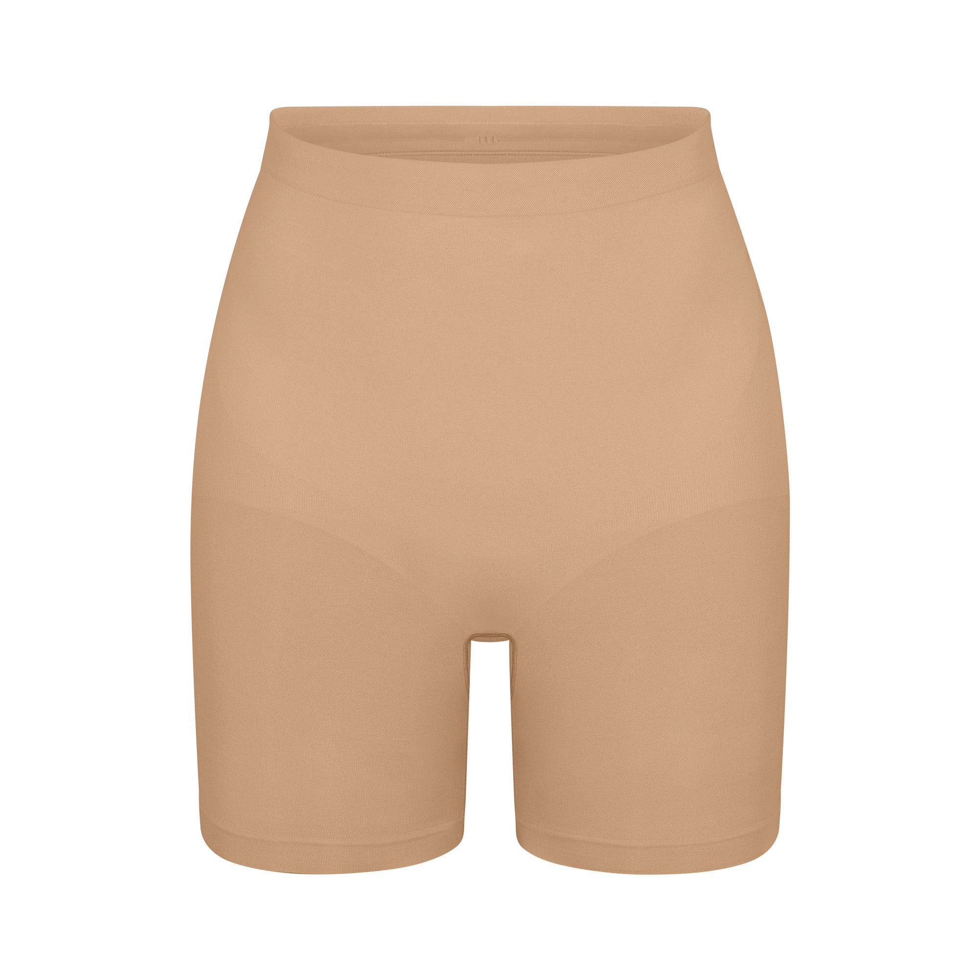 SEAMLESS SCULPT MID THIGH SHORT | CLAY (SHAPEWEAR SHORTS, SHAPEWEAR) LAYS FLAT ON A WHITE BACKGROUND | FLT