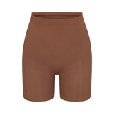 SEAMLESS SCULPT MID THIGH SHORT | JASPER (SHAPEWEAR SHORTS, SHAPEWEAR) LAYS FLAT ON A WHITE BACKGROUND | FLT