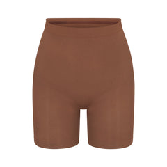 SEAMLESS SCULPT MID THIGH SHORT | JASPER (SHAPEWEAR SHORTS, SHAPEWEAR) LAYS FLAT ON A WHITE BACKGROUND | FLT