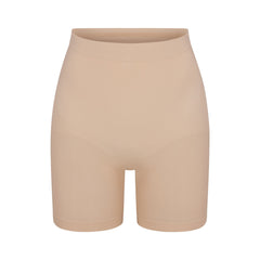 SEAMLESS SCULPT MID THIGH SHORT | MICA (SHAPEWEAR SHORTS, SHAPEWEAR) LAYS FLAT ON A WHITE BACKGROUND | FLT