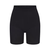 SEAMLESS SCULPT MID THIGH SHORT | ONYX (SHAPEWEAR SHORTS, SHAPEWEAR) LAYS FLAT ON A WHITE BACKGROUND | FLT