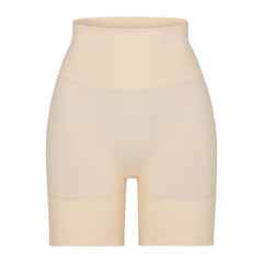 BUTT ENHANCING SHORT | SAND (SHAPEWEAR SHORTS, SHAPEWEAR) LAYS FLAT ON A WHITE BACKGROUND | FLT