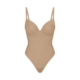 SKIMS ULTIMATE BODY PUSH-UP THONG BODYSUIT | CLAY FLAT ON A WHITE BACKGROUND | FLT | FLT