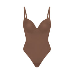 SKIMS ULTIMATE BODY PUSH-UP THONG BODYSUIT | JASPER FLAT ON A WHITE BACKGROUND | FLT | FLT