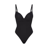 SKIMS ULTIMATE BODY PUSH-UP THONG BODYSUIT | ONYX FLAT ON A WHITE BACKGROUND | FLT | FLT