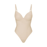 SKIMS ULTIMATE BODY PUSH-UP THONG BODYSUIT | SAND FLAT ON A WHITE BACKGROUND | FLT | FLT