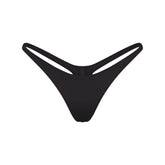 SIGNATURE SWIM THONG BIKINI BOTTOM | ONYX FLAT ON A WHITE BACKGROUND | FLT