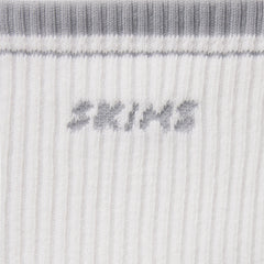 RIBBED QUARTER CREW LOGO SOCK | SNOW AND LIGHT HEATHER GREY & LAYS FLAT ON A WHITE BACKGROUND | FLT