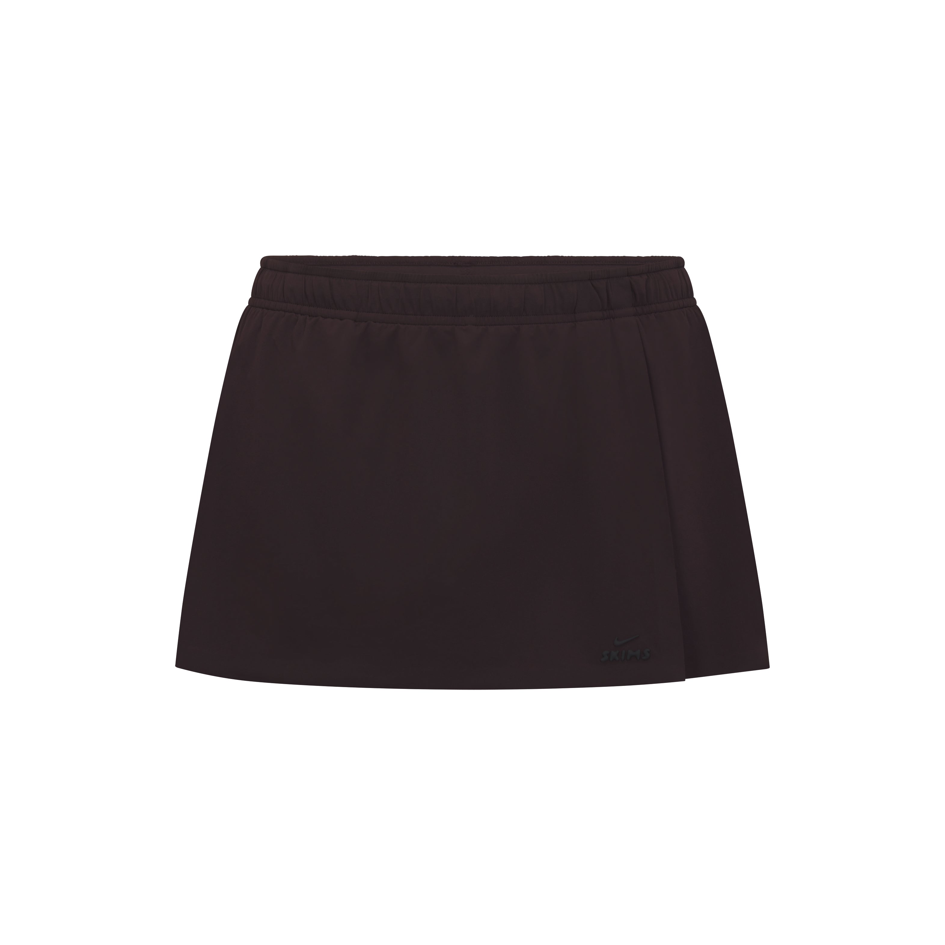 NikeSKIMS STRETCH NYLON SKORT | DARK ROAST & LAYS FLAT ON A WHITE BACKGROUND | FLT
