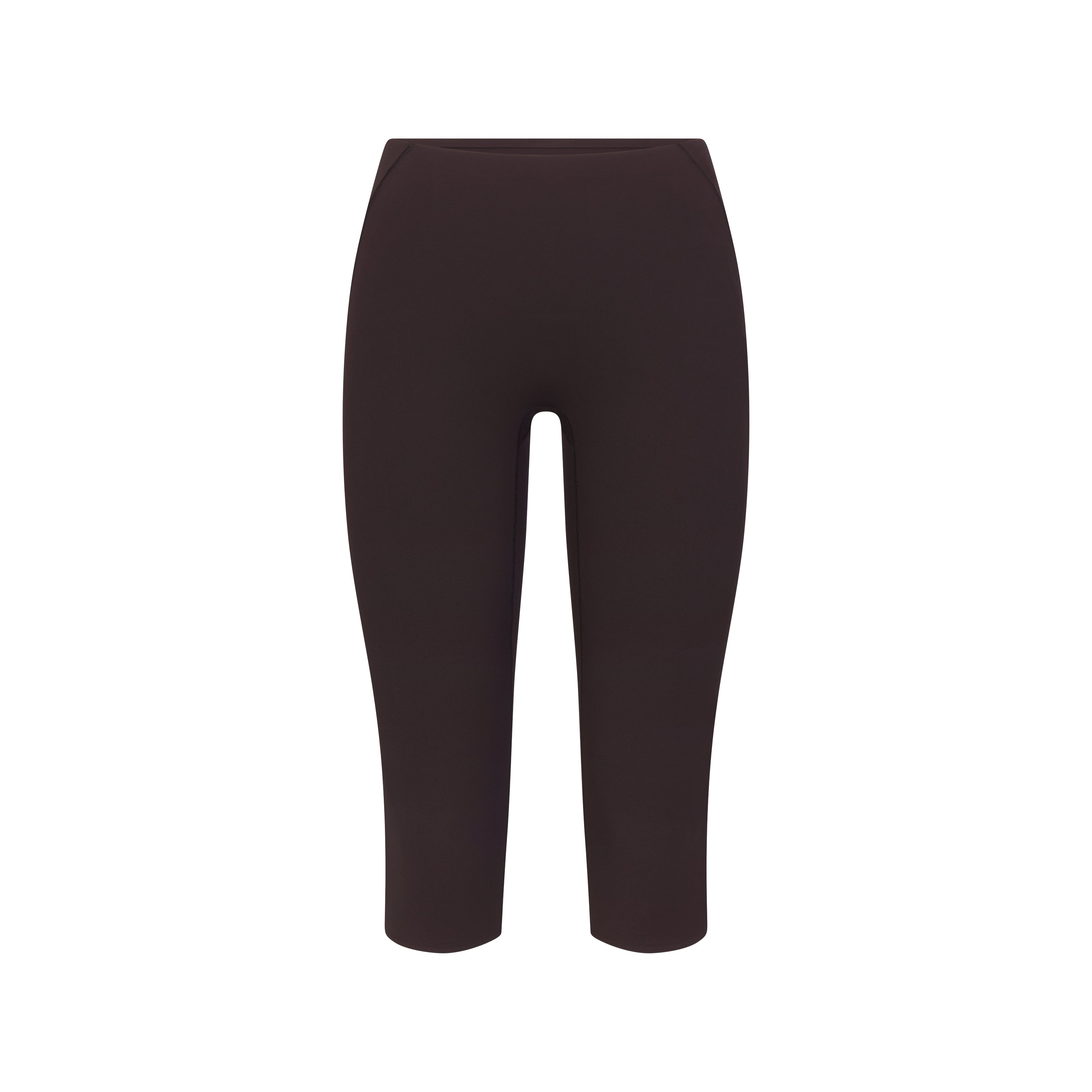 NikeSKIMS STUDIO STRETCH 17" CAPRI LEGGING | DARK ROAST | DRIFTWOOD FLAT ON A WHITE BACKGROUND | FLT