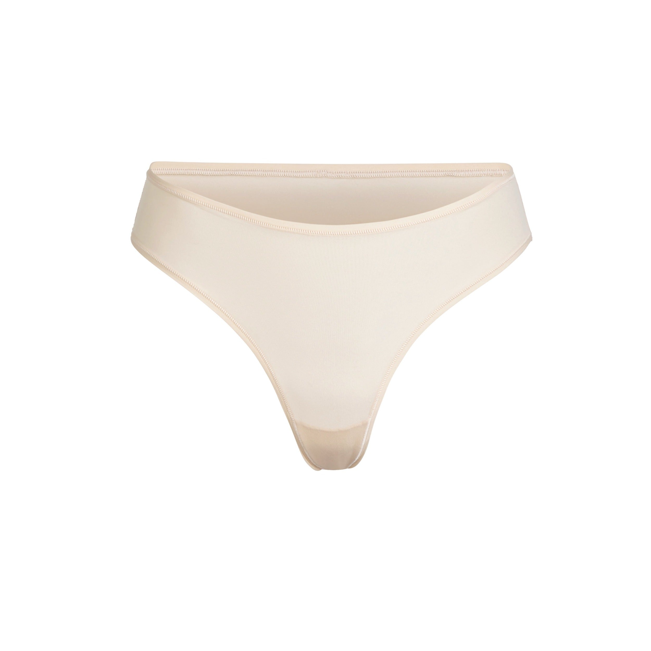 FITS EVERYBODY THONG | SAND (THONGS, PANTIES) LAYS FLAT ON A WHITE BACKGROUND | FLT