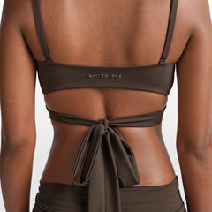 NikeSKIMS MATTE WRAP FRONT BRA | DARK SEPIA ON A MODEL FRONT VIEW @ | FOCUS: 0.0, 1.0, 0.9