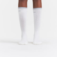 RIBBED CREW LOGO SOCK | SNOW AND LIGHT HEATHER GREY ON A MODEL | FOCUS: 0.0, 1.0, 0.9