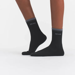 RIBBED QUARTER CREW LOGO SOCK | ONYX AND DARK HEATHER GREY ON A MODEL | FOCUS: 0.0, 1.0, 0.9