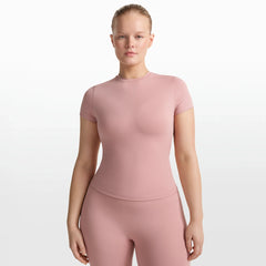 NikeSKIMS MATTE PADDED BABY TEE | HIMALAYAN ON A MODEL FRONT VIEW @ | FOCUS: 0.0, 1.0, 0.9
