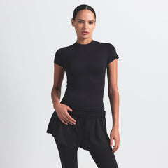 NikeSKIMS MATTE PADDED BABY TEE | OBSIDIAN ON A MODEL FRONT VIEW @ | FOCUS: 0.0, 1.0, 0.9