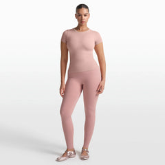 NikeSKIMS RIBBED SEAMLESS BABY TEE | HIMALAYAN ON A MODEL FRONT VIEW @ | FOCUS: 0.0, 1.0, 0.9