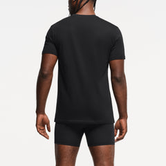 SKIMS BASICS MENS LIGHTWEIGHT T-SHIRT 3-PACK | OBSIDIAN ON A MODEL BACK VIEW
