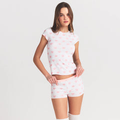 LOGO POINTELLE BABY TEE AND SHORT SET | SNOW LACE HEARTS ON A MODEL SIDE VIEW @ | FOCUS: 0.0, 1.0, 0.9