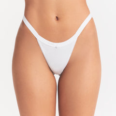 LIGHTWEIGHT COTTON LOGO PICOT THONG | SNOW ON A MODEL SIDE VIEW| FOCUS: 0.0, 1.0, 0.9