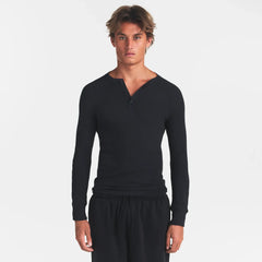 SKIMS COTTON RIB MENS HENLEY | ONYX ON A MODEL FRONT VIEW @ | FOCUS: 0.0, 1.0, 0.9