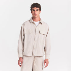 WOVEN MENS RELAXED SHIRT | STONE ON A MODEL SIDE VIEW @ | FOCUS: 0.0, 1.0, 0.9