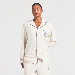 SKIMS FOR TEAM USA UNISEX FLEECE OLYMPIC OVERSIZED SLEEP TOP | ECRU ON A MODEL SIDE VIEW @ | FOCUS: 0.0, 1.0, 0.9