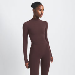 NikeSKIMS VINTAGE SEAMLESS MOCK NECK CROP TOP | PHOENIX ON A MODEL SIDE VIEW