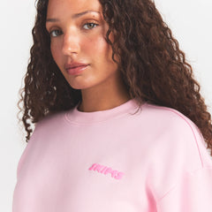 COTTON FLEECE CLASSIC CREWNECK | CHERRY BLOSSOM ON A MODEL SIDE VIEW @ | FOCUS: 0.0, 1.0, 0.9