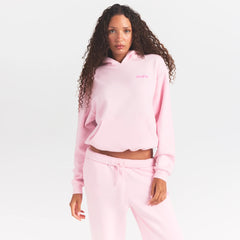 COTTON FLEECE HOODIE WITH EMBOSSED LOGO | CHERRY BLOSSOM ON A MODEL SIDE VIEW @ | FOCUS: 0.0, 1.0, 0.9