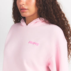 COTTON FLEECE HOODIE WITH EMBOSSED LOGO | CHERRY BLOSSOM ON A MODEL SIDE VIEW @ | FOCUS: 0.0, 1.0, 0.9